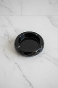 Handmade resin ashtray with a unique artistic design.
